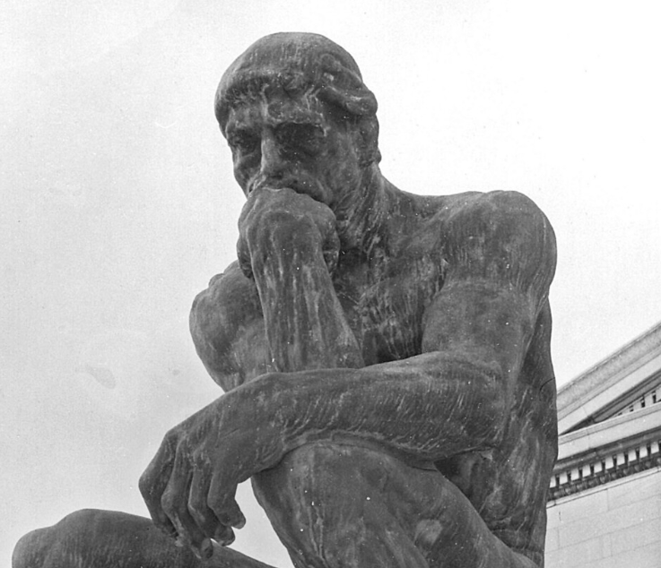 Close-up view of the thoughtful face of the famous Rodin sculpture called "The Thinker"