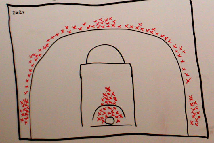 Drawing in black and red on a whiteboard of the common shooting points in basketball as of 2021.
