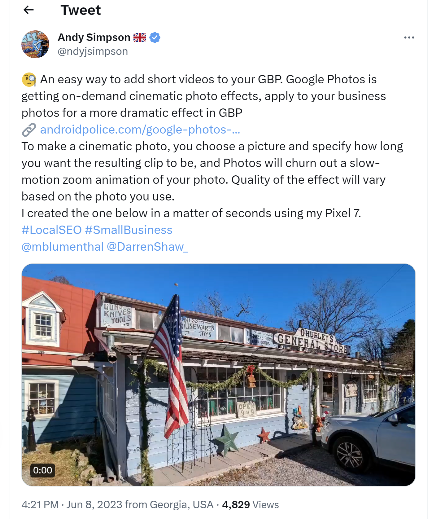 Screenshot of a tweet featuring a video in which animation causes a zooming in effect on a business storefront, turning a still shot into a video