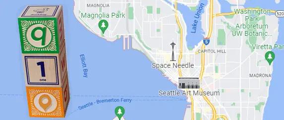 Wooden building blocks on a map